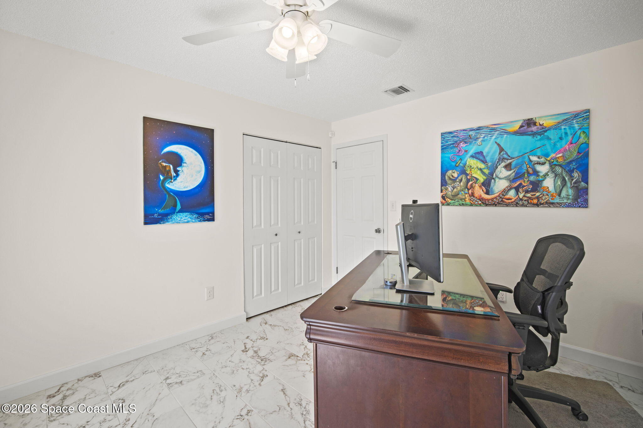 1505 South Carpenter Road Titusville, FL 32796 - Photo 23 of 36 a view of a workspace with furniture