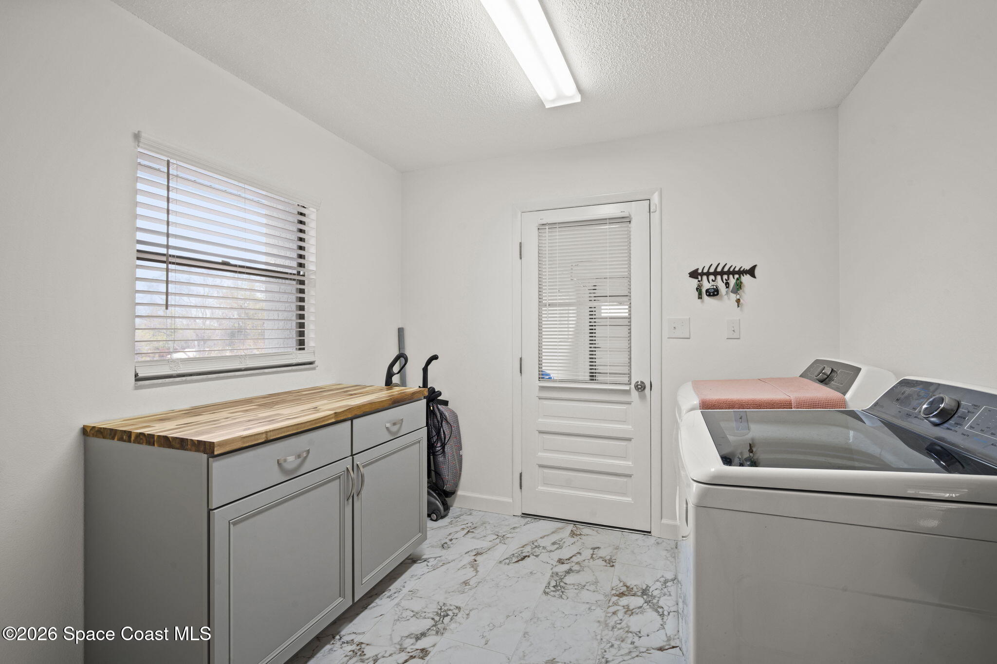 1505 South Carpenter Road Titusville, FL 32796 - Photo 27 of 36 a room with storage and utility