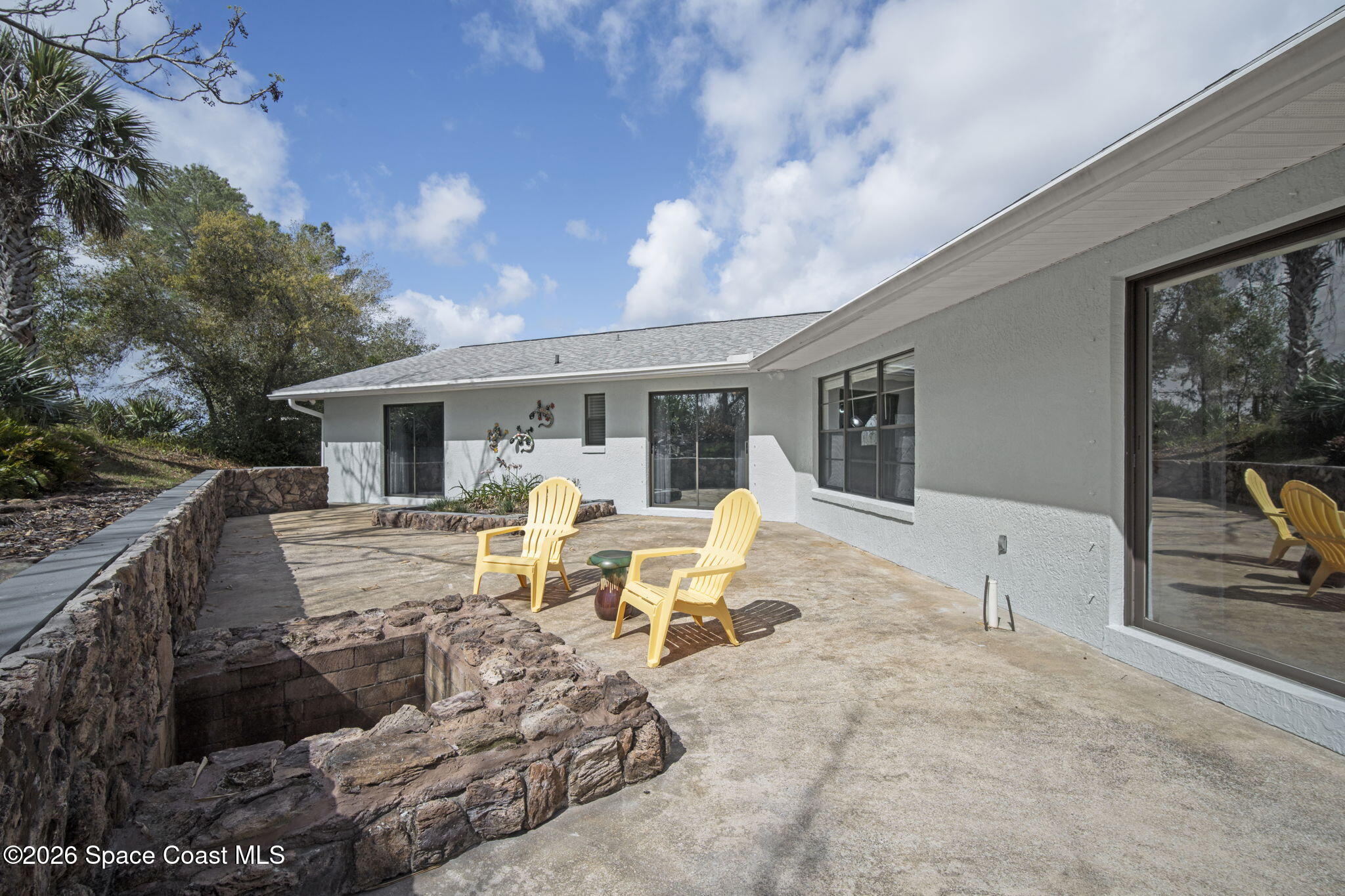 1505 South Carpenter Road Titusville, FL 32796 - Photo 28 of 36 a view of a sitting area with furniture in front of house