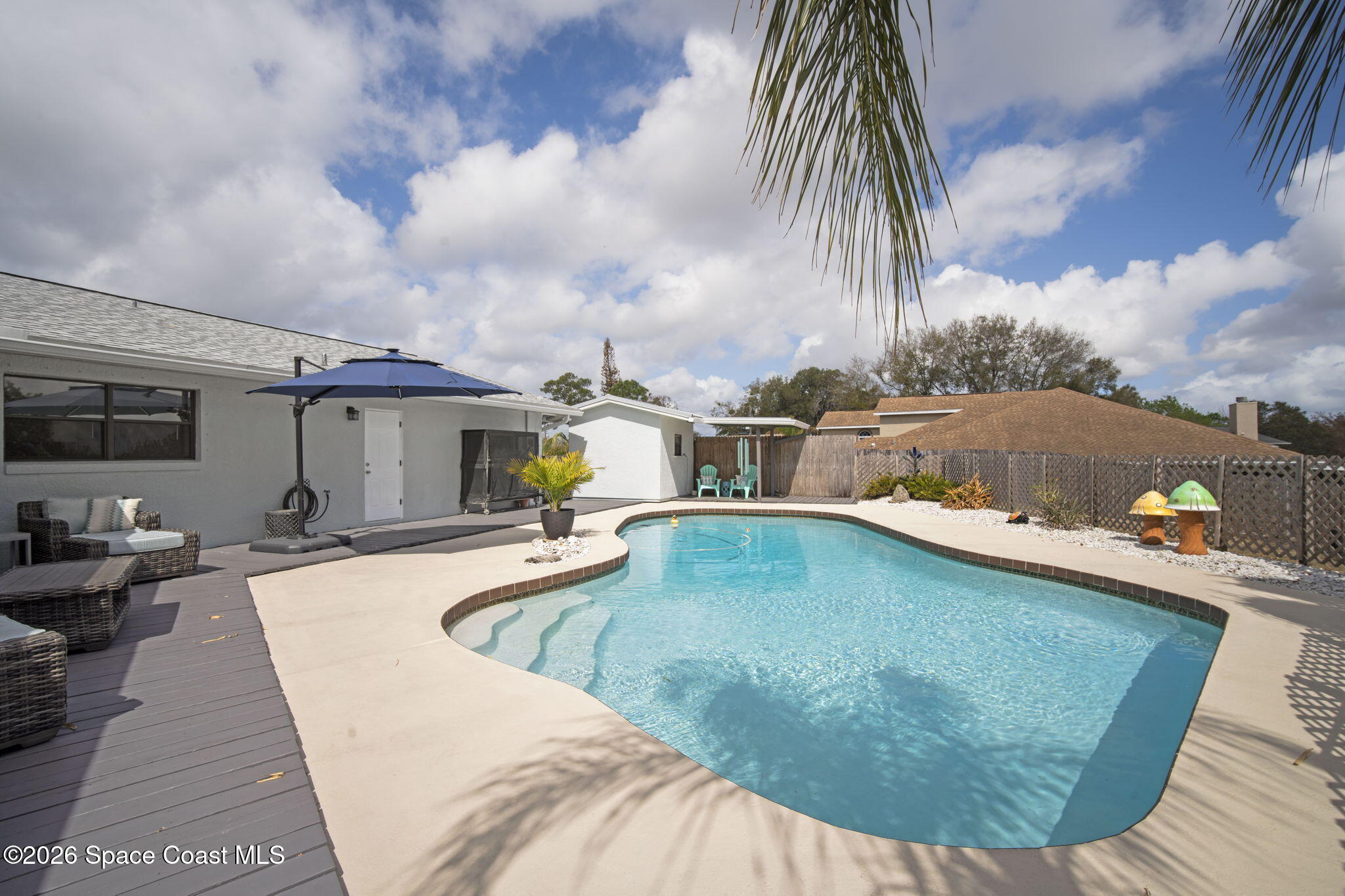 1505 South Carpenter Road Titusville, FL 32796 - Photo 29 of 36 a view of a swimming pool with a patio