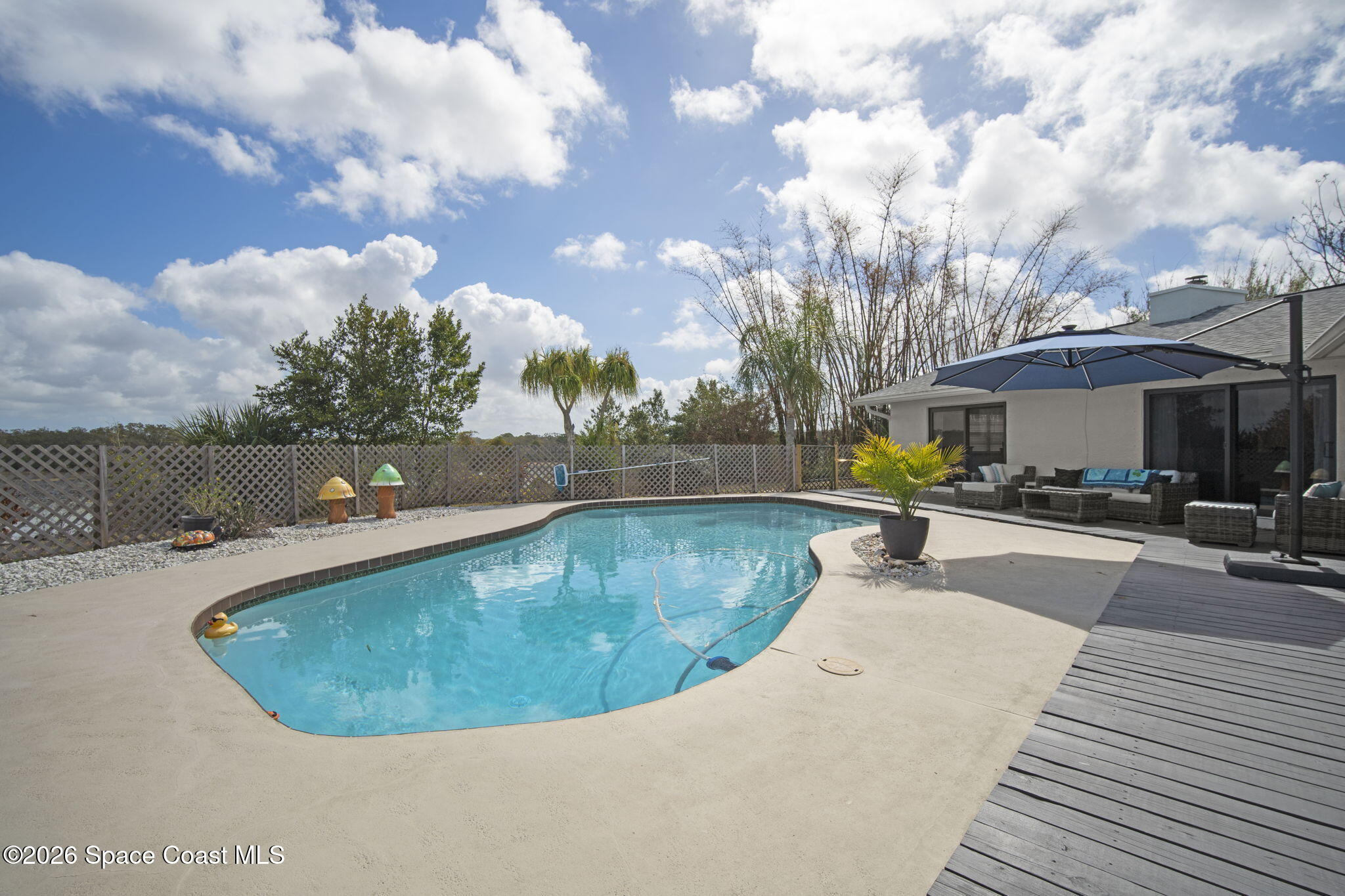 1505 South Carpenter Road Titusville, FL 32796 - Photo 30 of 36 a view of a swimming pool with sitting area