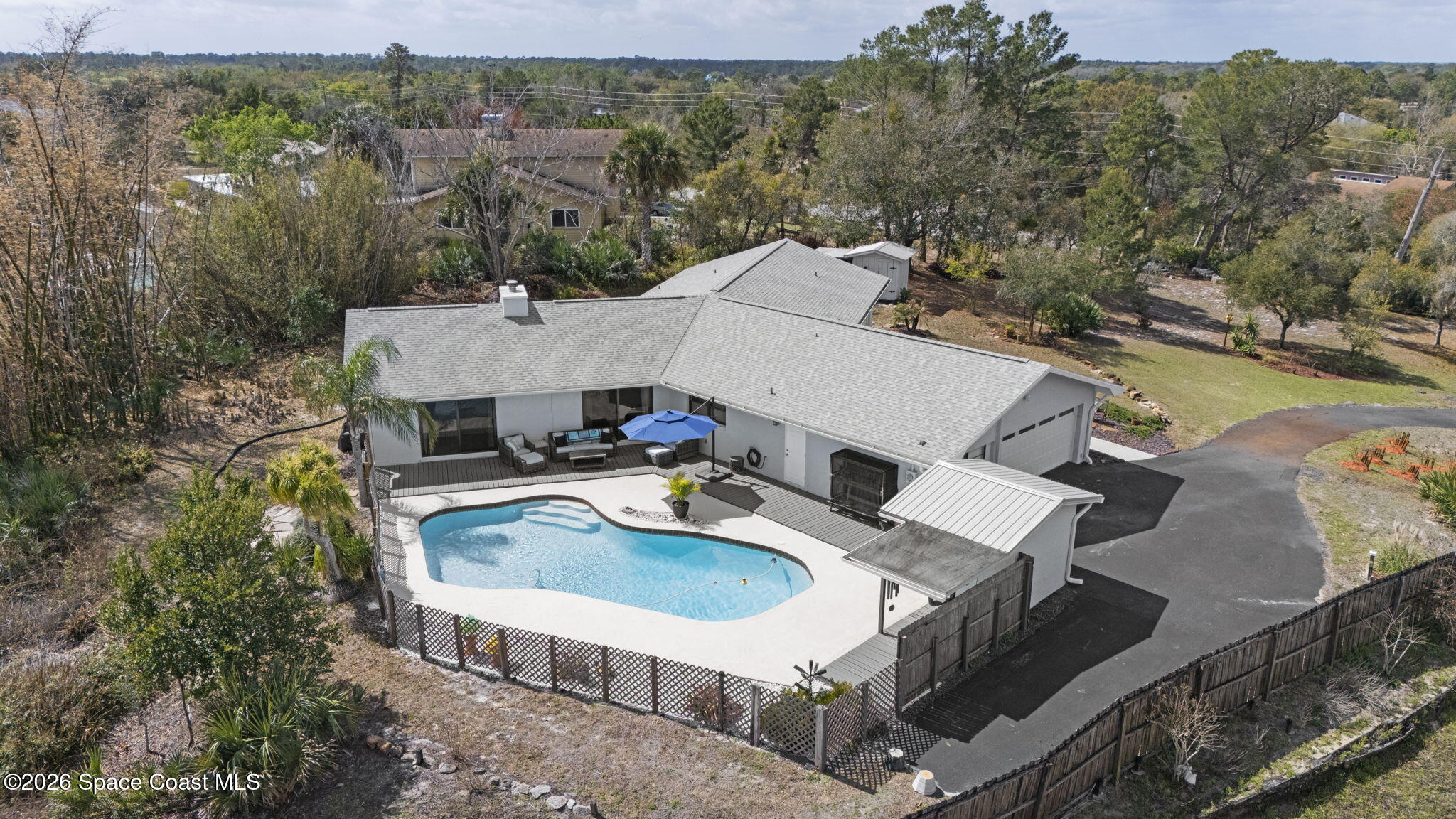 1505 South Carpenter Road Titusville, FL 32796 - Photo 34 of 36 an aerial view of a house with swimming pool and mountain view