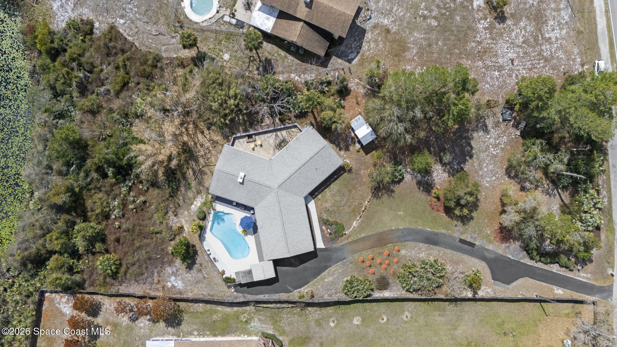 1505 South Carpenter Road Titusville, FL 32796 - Photo 36 of 36 a view of a house with a yard and sitting area
