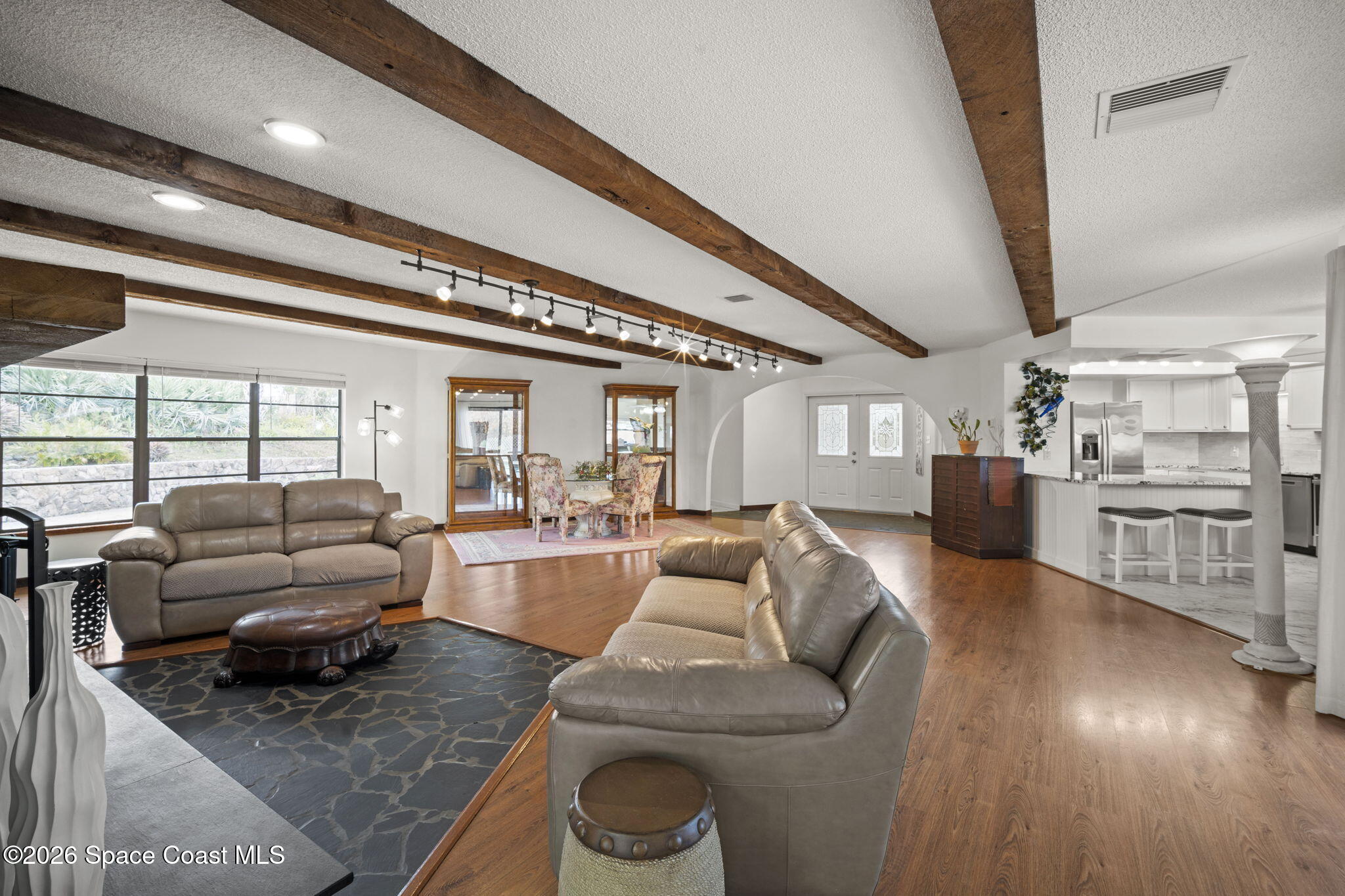 1505 South Carpenter Road Titusville, FL 32796 - Photo 5 of 36 a living room with furniture and a large window