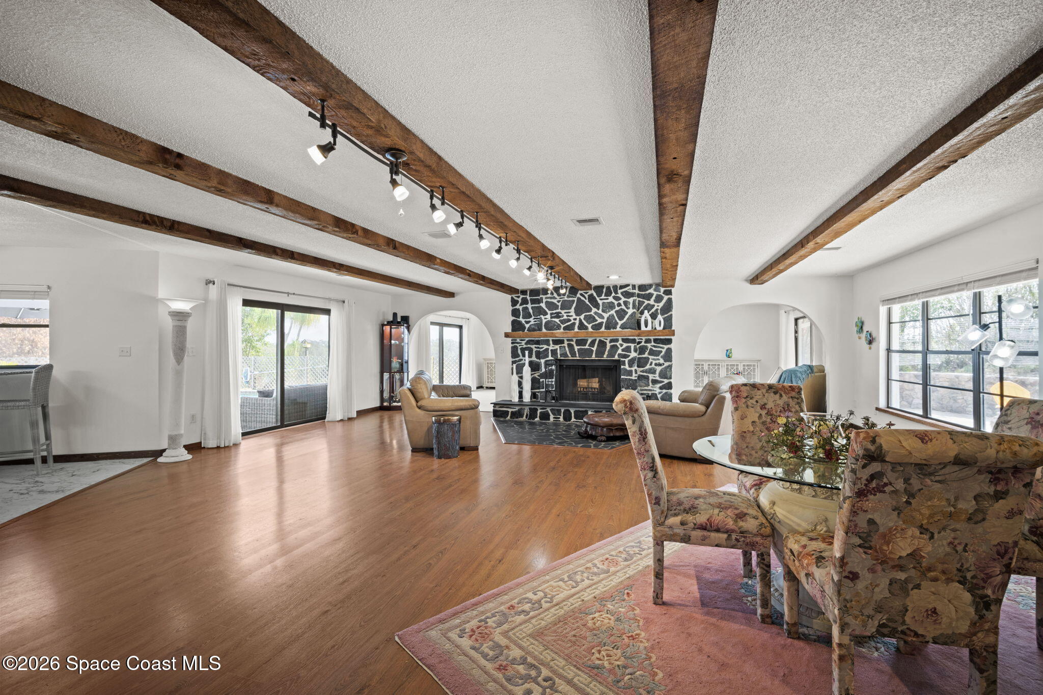 1505 South Carpenter Road Titusville, FL 32796 - Photo 8 of 36 a view of a livingroom with furniture window and wooden floor