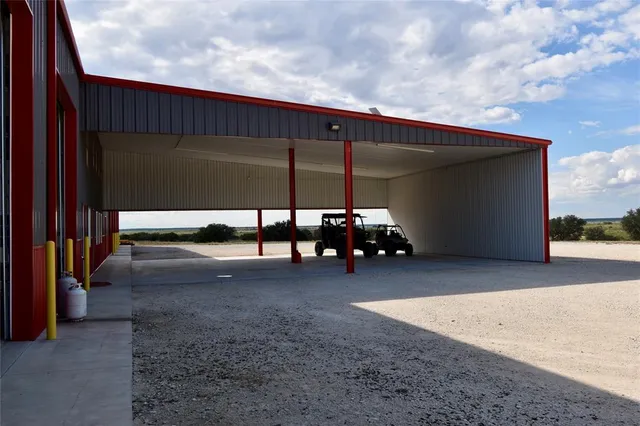 a kitchen with stainless steel appliances kitchen island granite countertop a stove a sink a refrigerator and a microwave