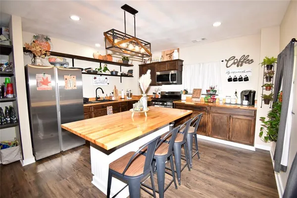 a bed room with a bed and a chandelier