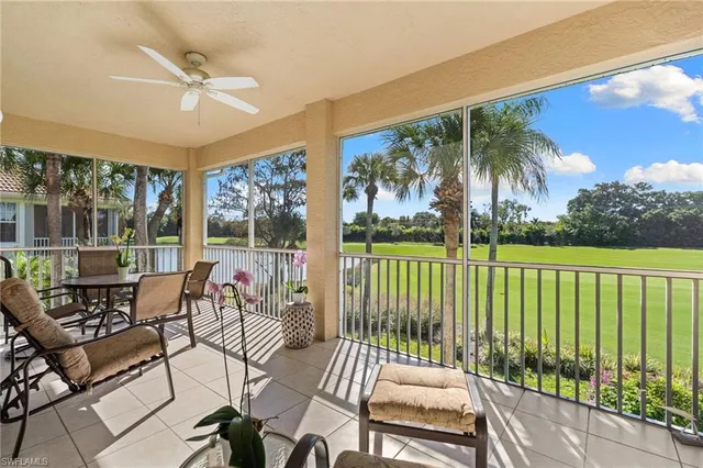 a view of a chairs and table in patio