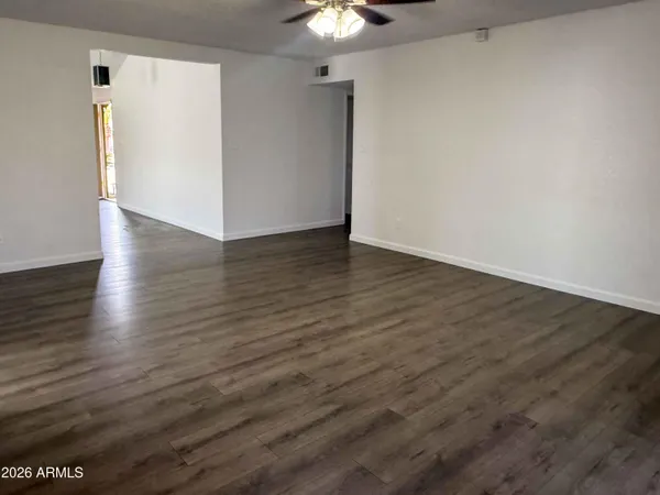a view of gallery with wooden floor