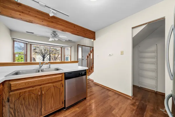 a kitchen with a sink and a refrigerator