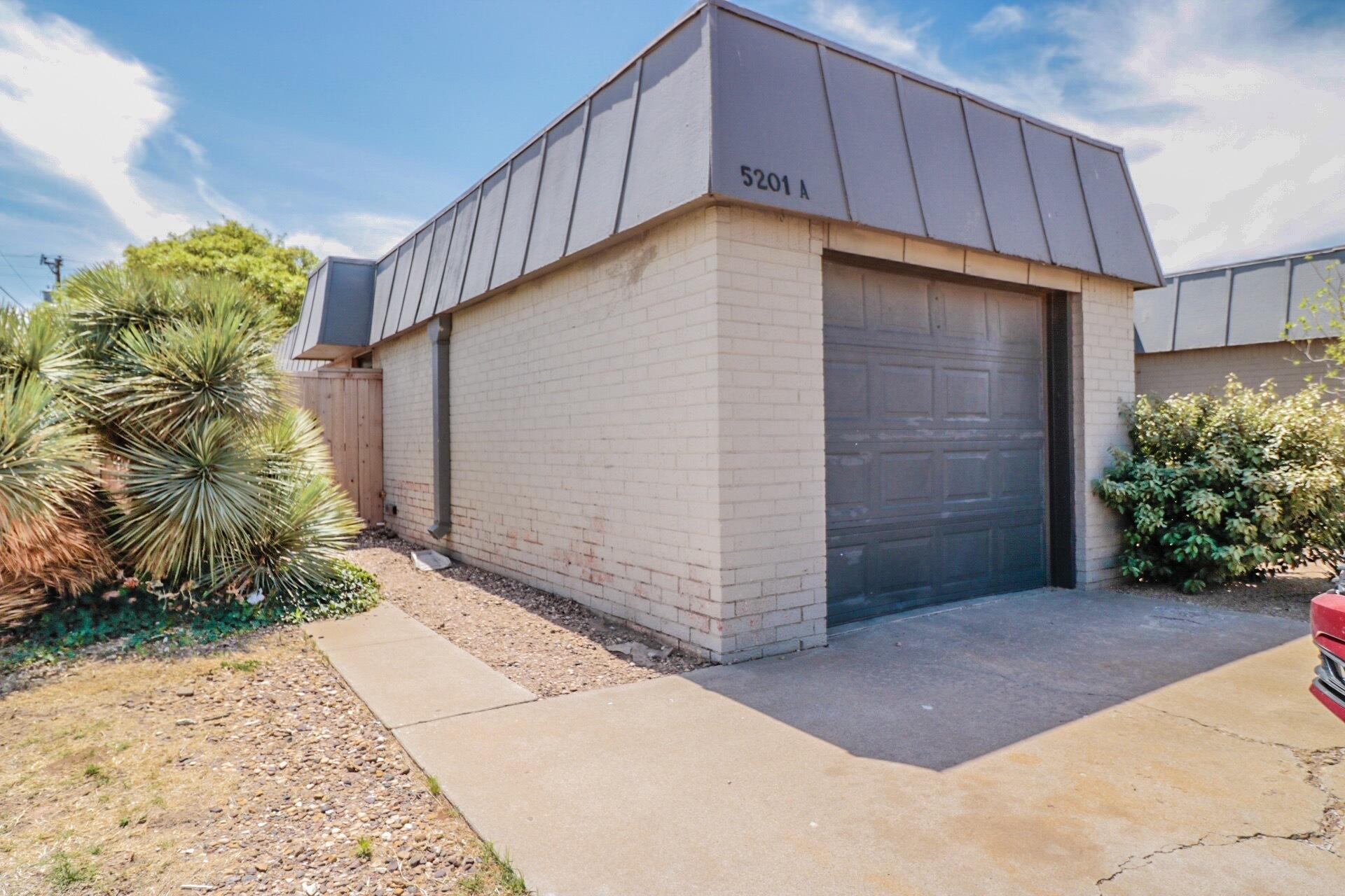 5201 18th Street, Unit A Lubbock, TX 79416 - Photo 1 of 10 a view of a house with a yard