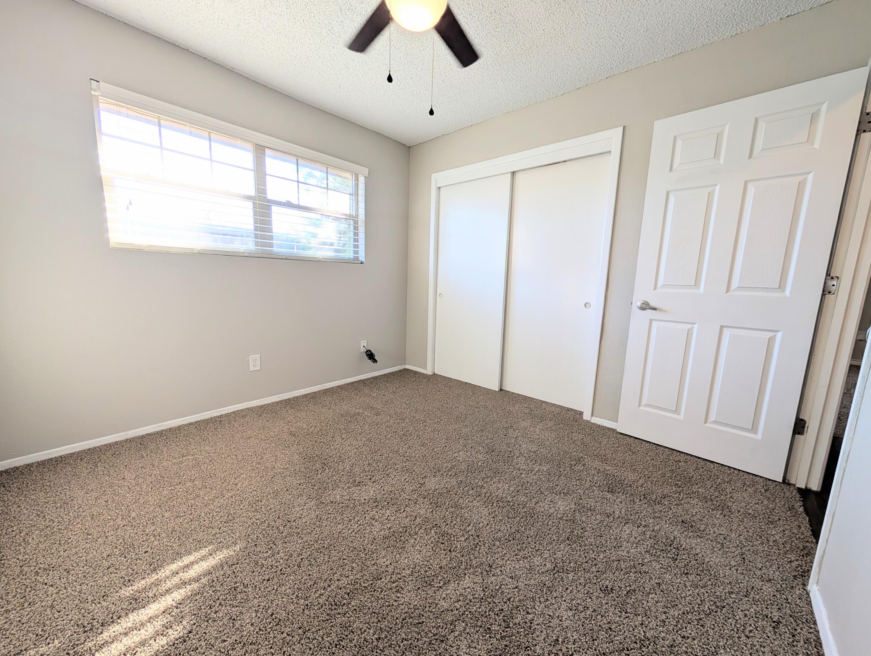 5201 18th Street, Unit A Lubbock, TX 79416 - Photo 8 of 10 a view of an empty room with a window
