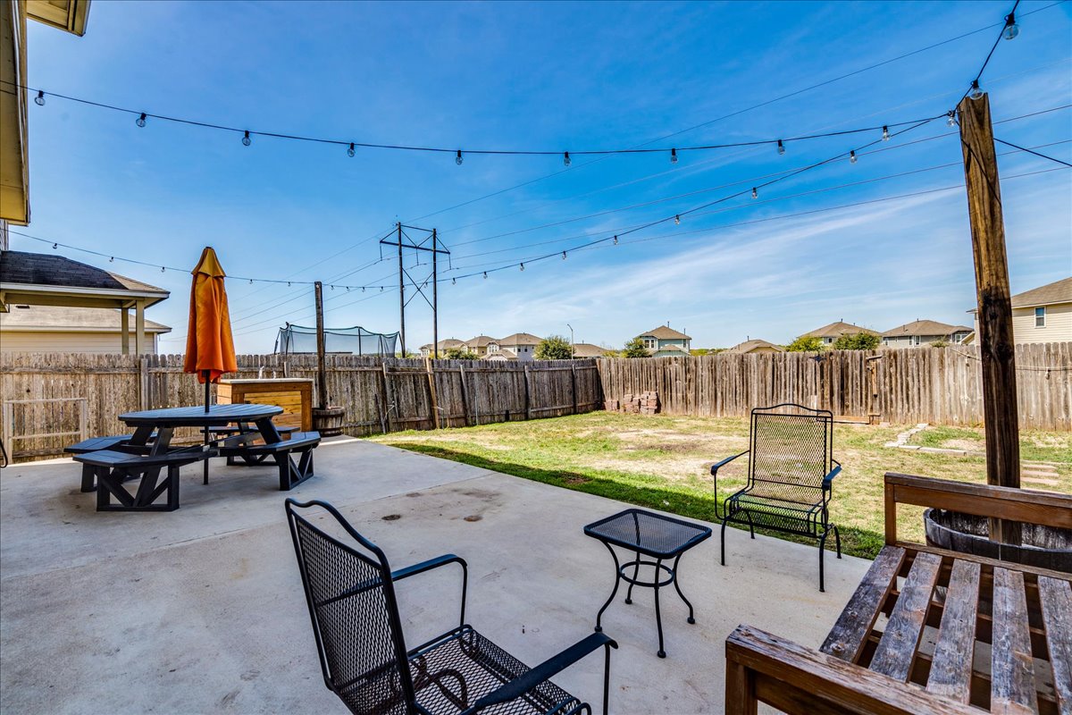 312 Triumph Road Buda, TX 78610 - Photo 32 of 36 a view of a terrace with furniture