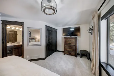 a view of a livingroom with furniture and a window