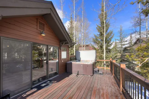 a view of a terrace with furniture and wooden floor