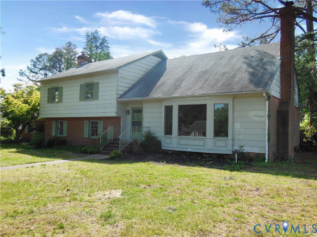 8218 Overbury Road Richmond, VA 23227 - Photo 1 of 37 a view of a house with a yard