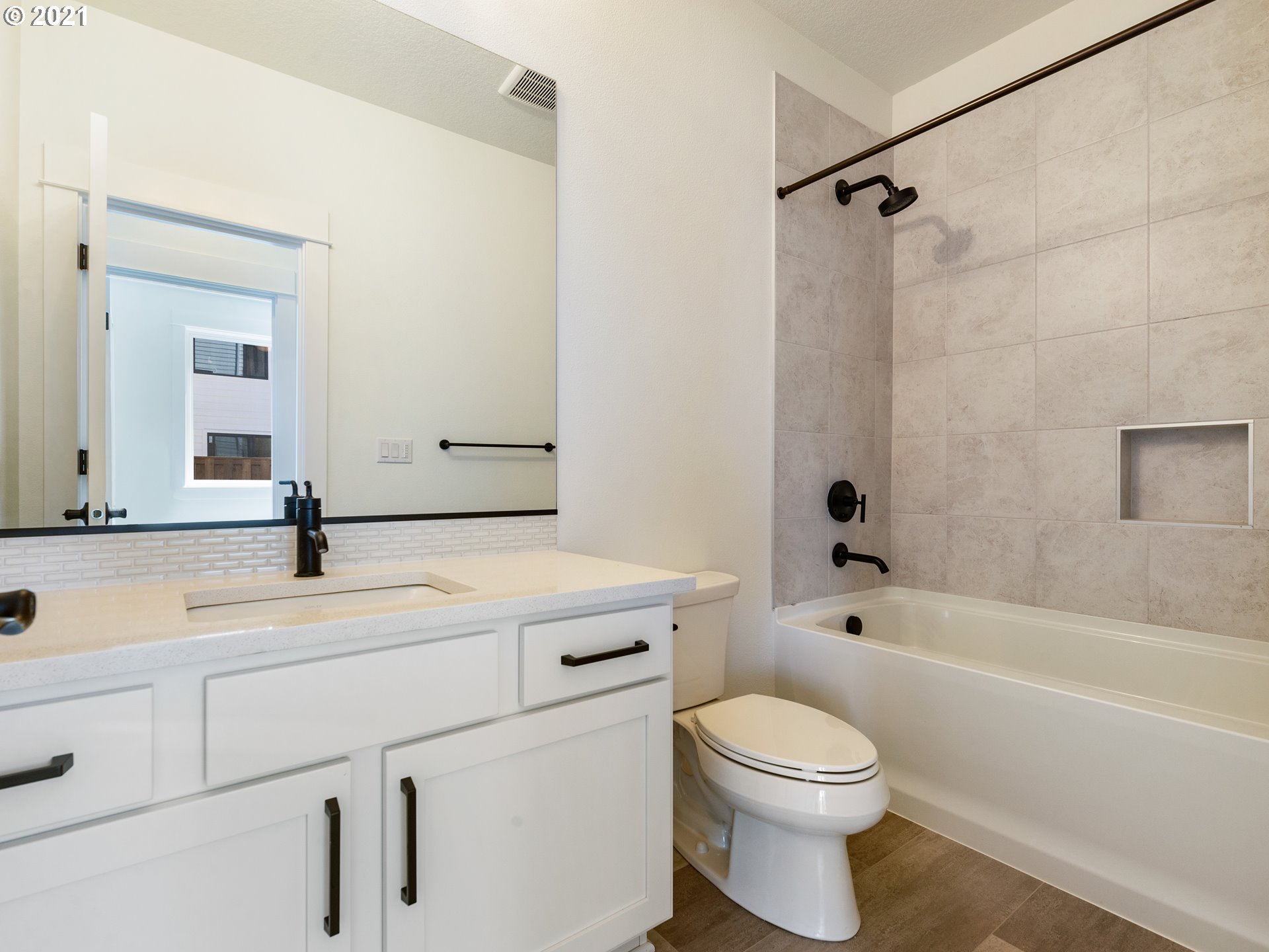 11542 Northwest Kearney Street Portland, OR 97229 - Photo 11 of 24 a bathroom with a sink a toilet and a bathtub