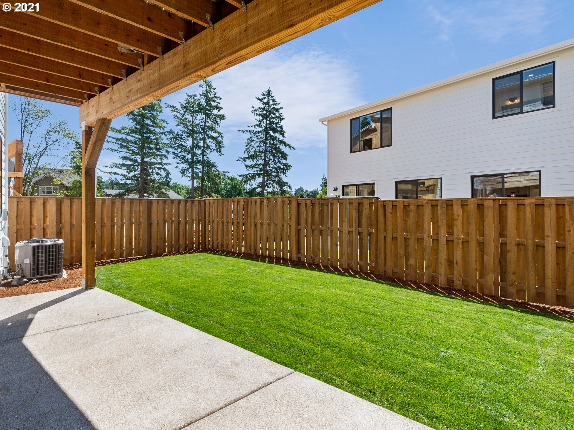 11542 Northwest Kearney Street Portland, OR 97229 - Photo 12 of 24 a view of a backyard with wooden fence
