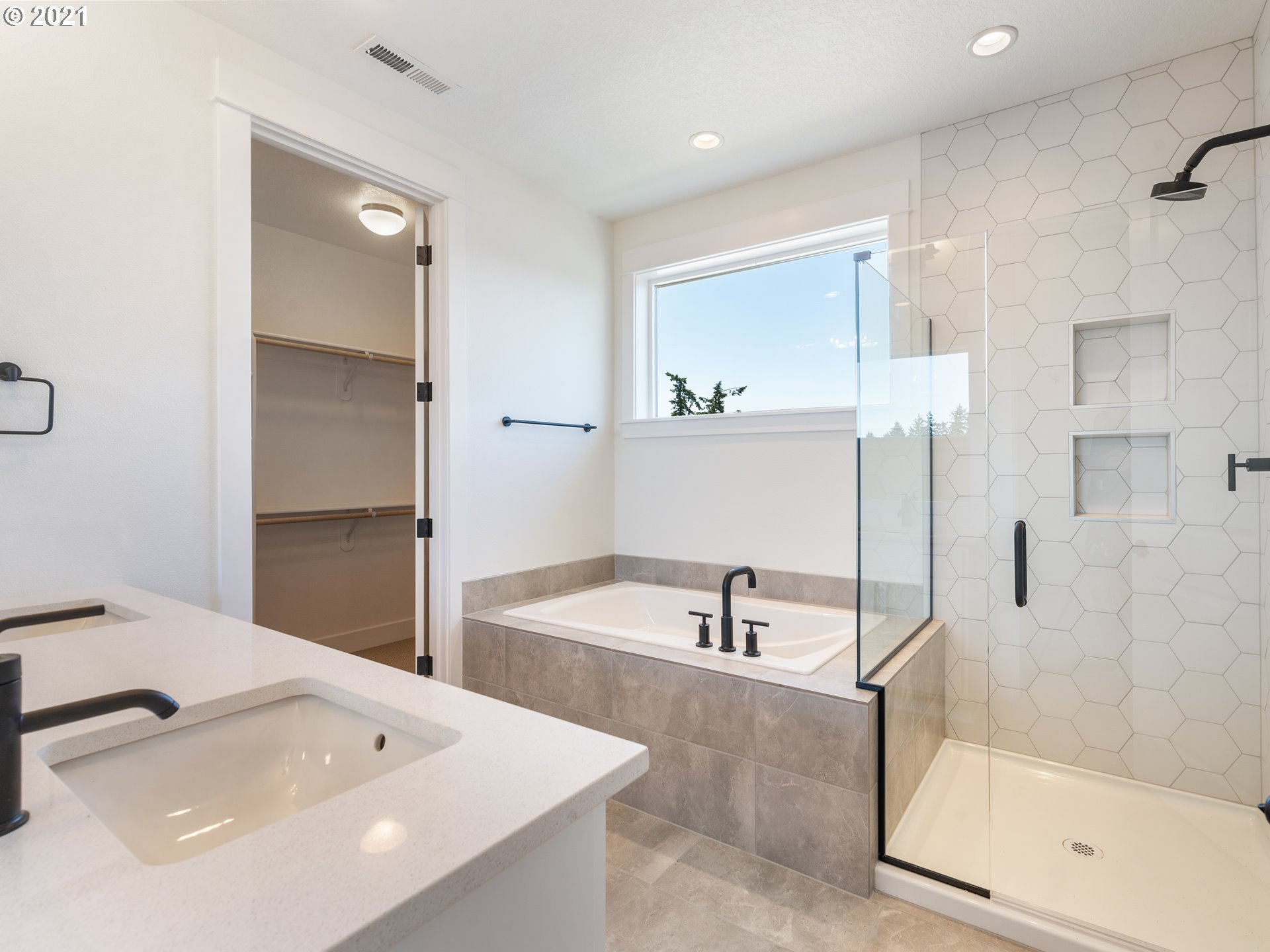 11542 Northwest Kearney Street Portland, OR 97229 - Photo 16 of 24 a bathroom with a tub and a sink