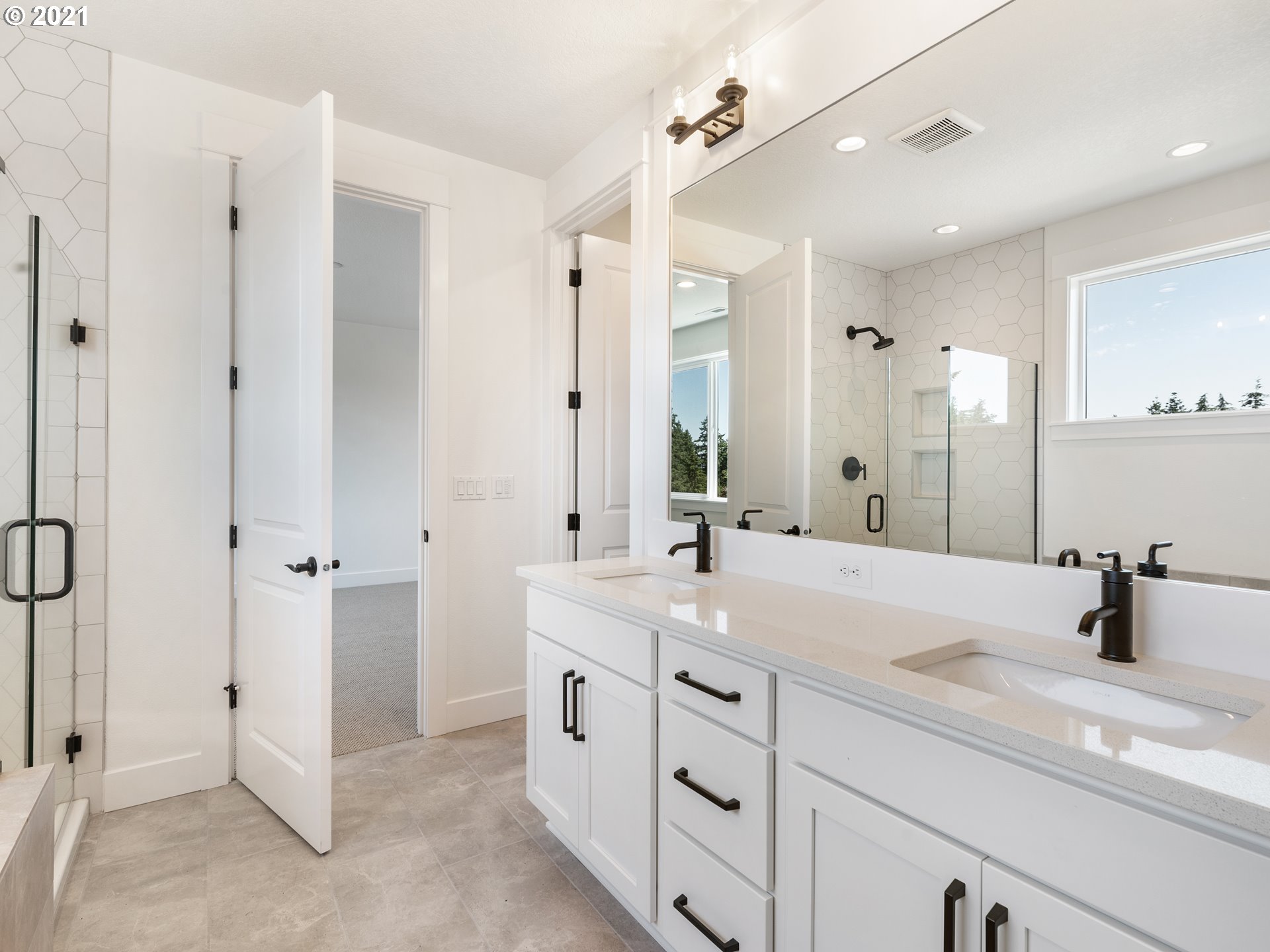 11542 Northwest Kearney Street Portland, OR 97229 - Photo 18 of 24 a bathroom with a sink double vanity and a mirror