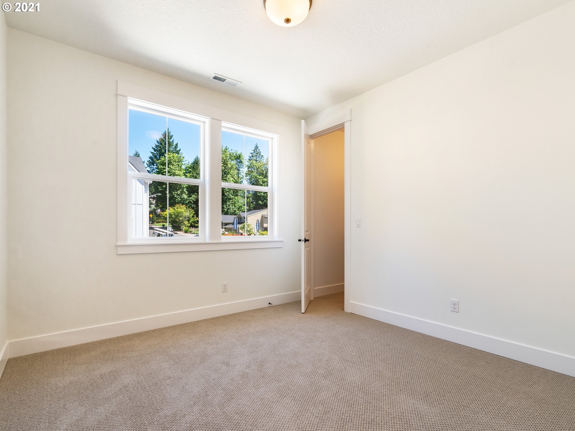 11542 Northwest Kearney Street Portland, OR 97229 - Photo 21 of 24 an empty room with windows