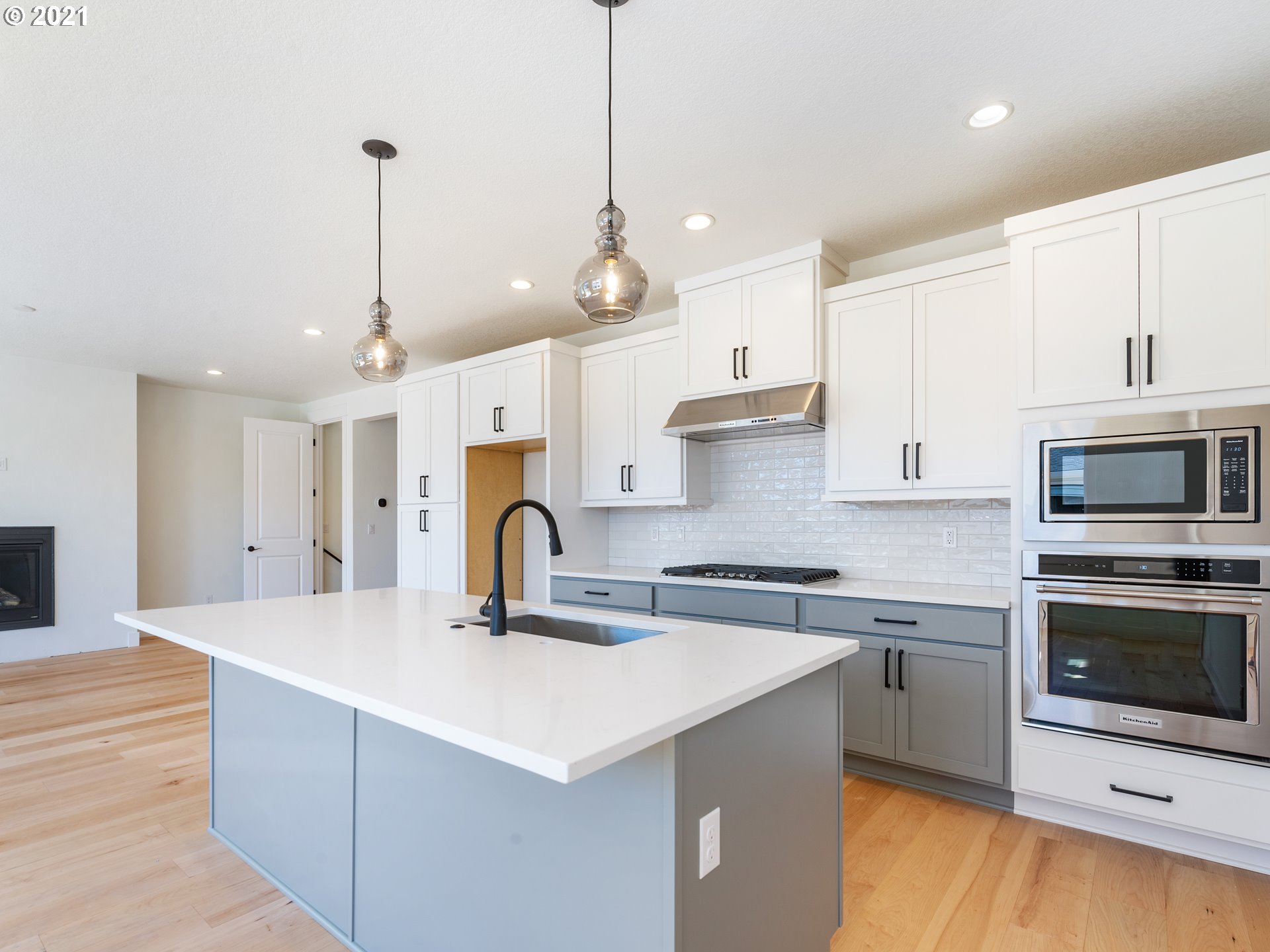 11542 Northwest Kearney Street Portland, OR 97229 - Photo 6 of 24 a kitchen with a sink stainless steel appliances and white cabinets
