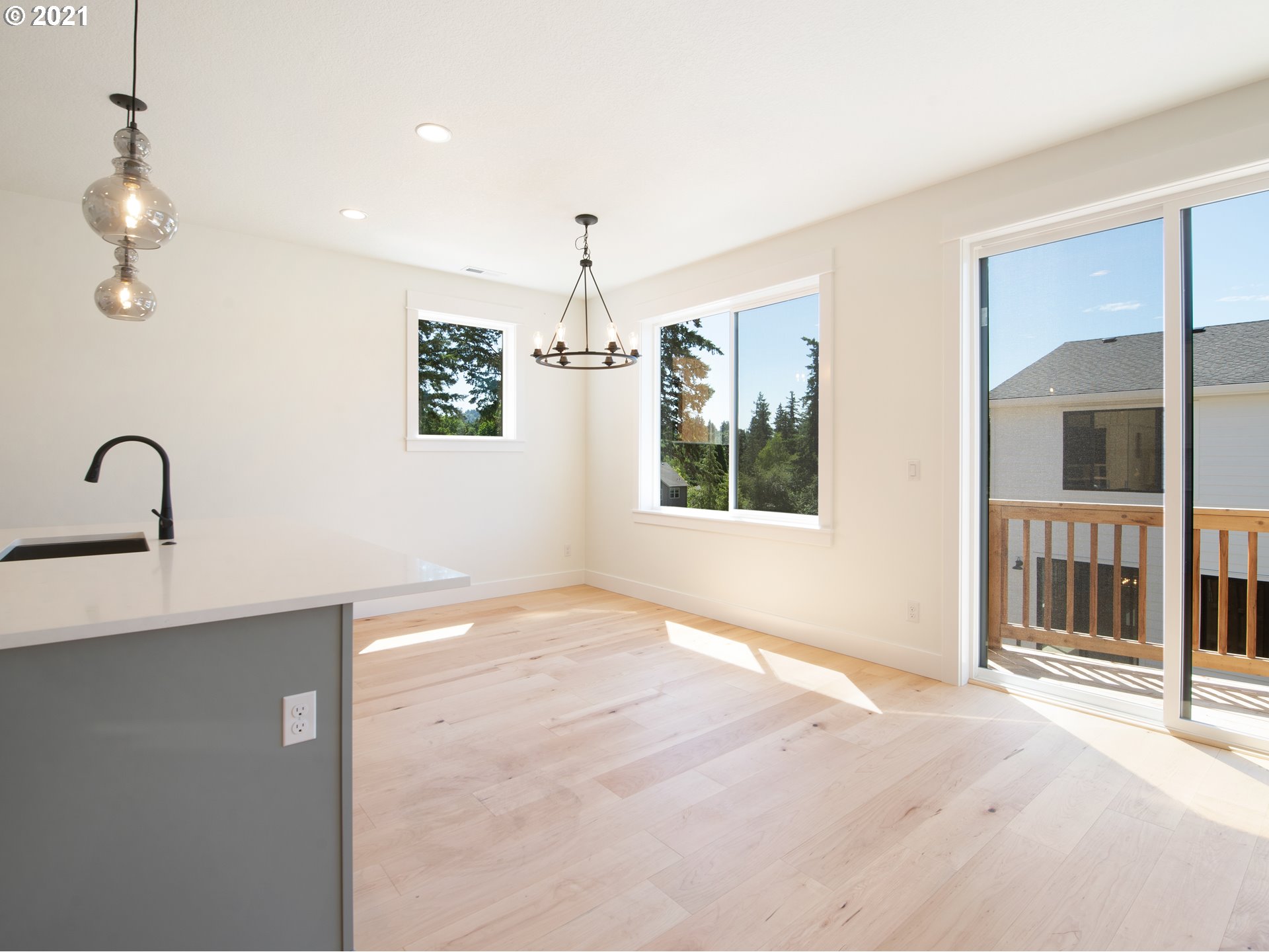 11542 Northwest Kearney Street Portland, OR 97229 - Photo 7 of 24 a view of an empty room with window cabinet and a window
