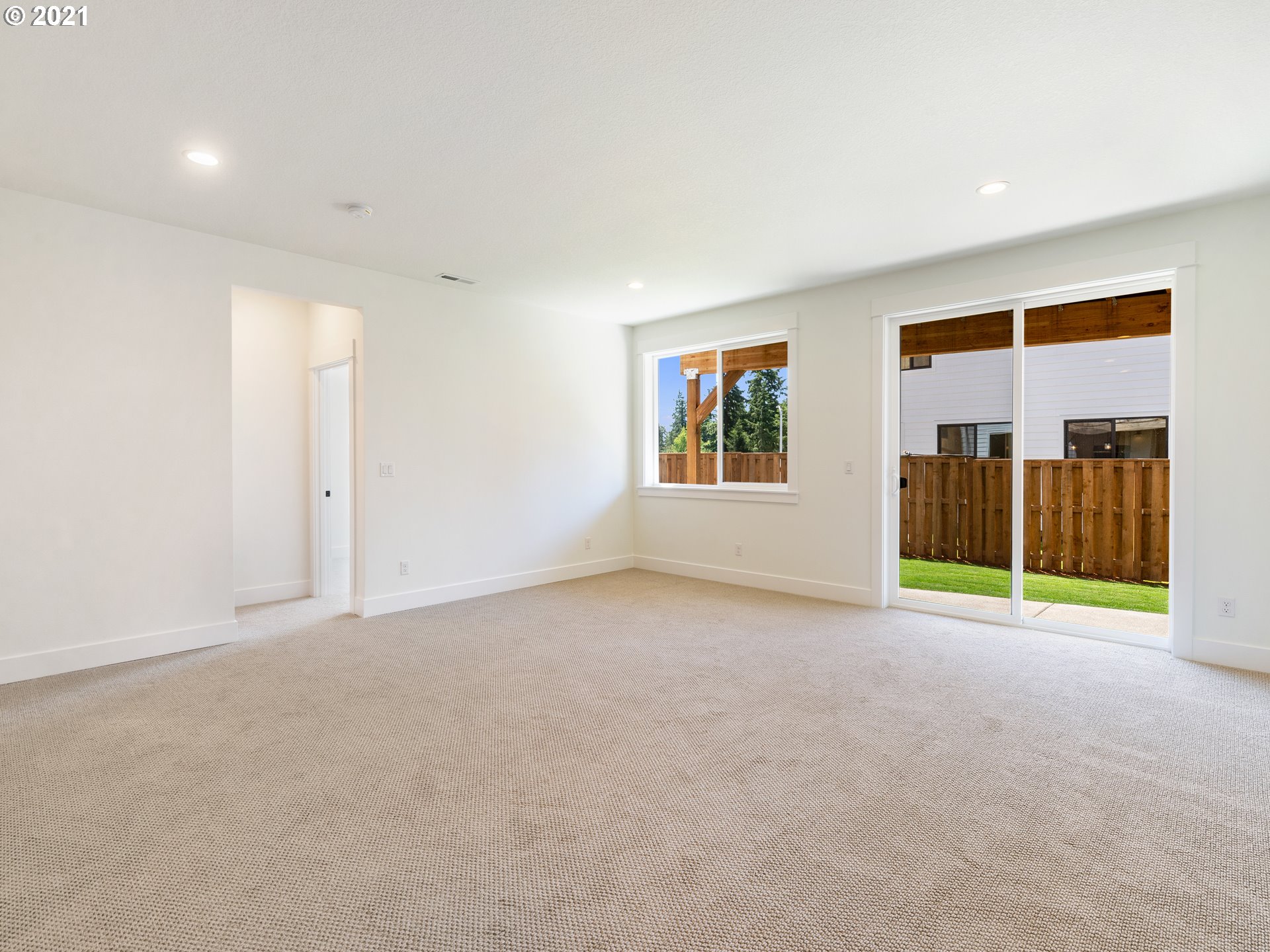 11542 Northwest Kearney Street Portland, OR 97229 - Photo 8 of 24 a view of an empty room with a window