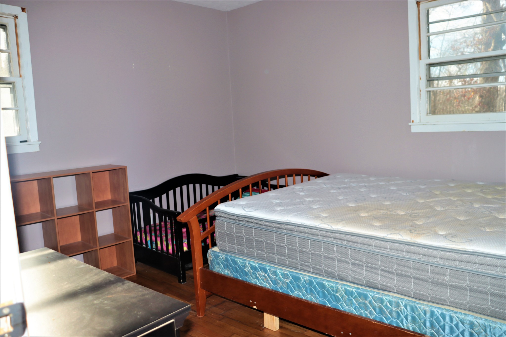 176 Pine Street Parsons, TN 38363 - Photo 20 of 32 a bedroom with a bed and a window