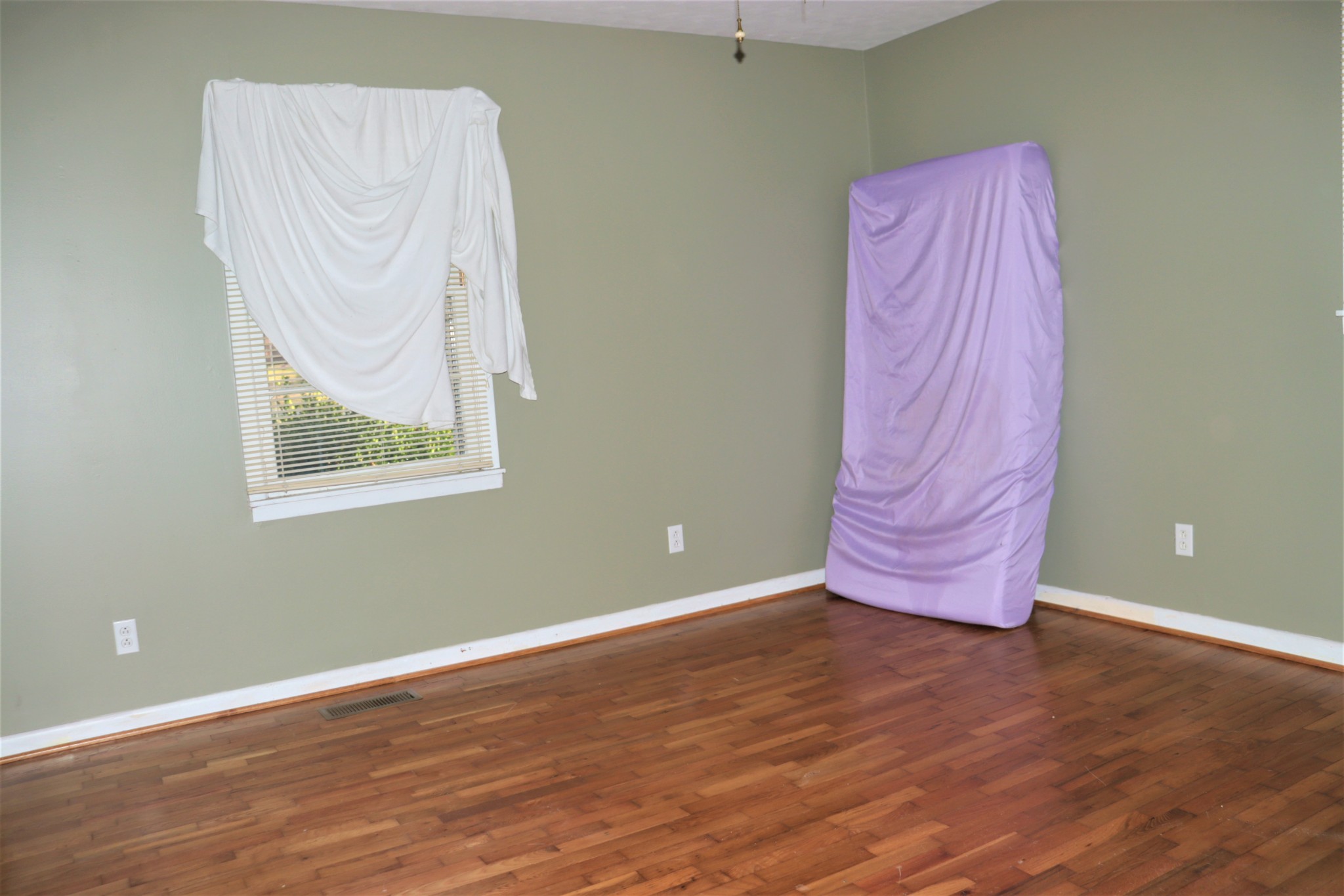 176 Pine Street Parsons, TN 38363 - Photo 21 of 32 a view of a room with wooden floor and cabinet