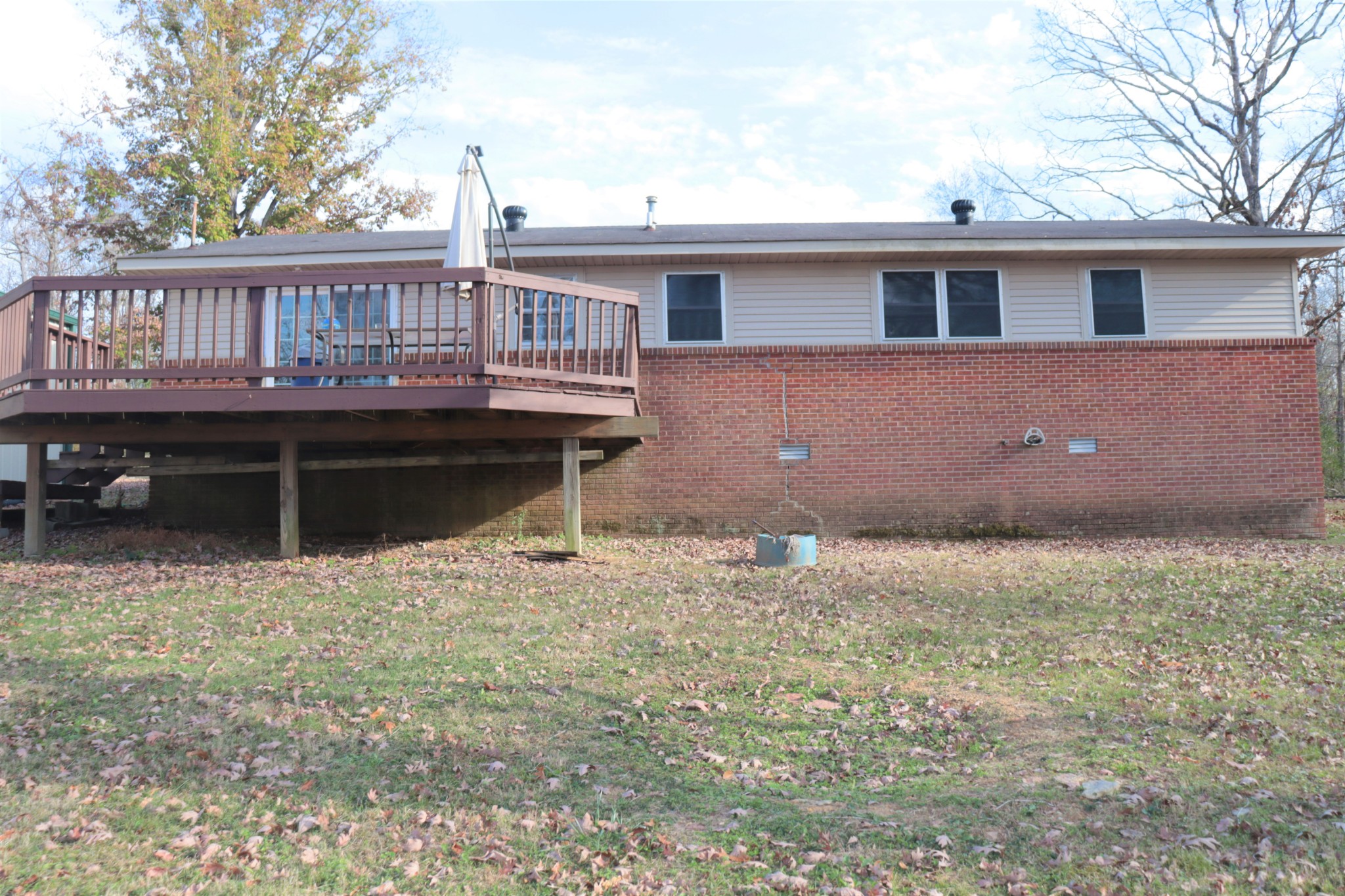 176 Pine Street Parsons, TN 38363 - Photo 29 of 32 a view of a house with wooden deck and furniture