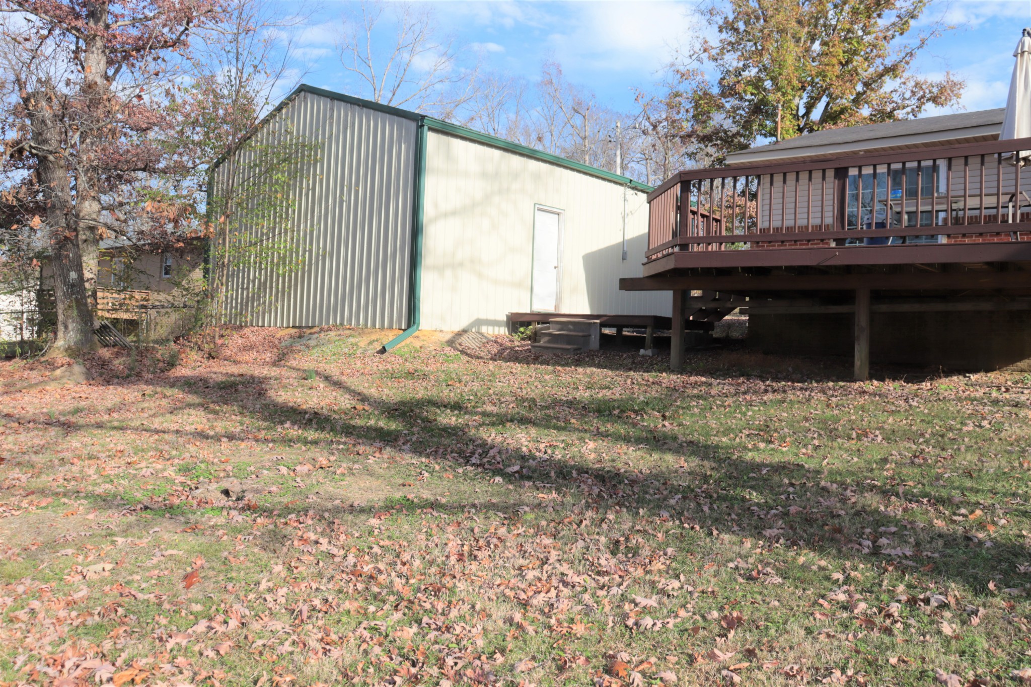 176 Pine Street Parsons, TN 38363 - Photo 30 of 32 a view of a house with a yard and sitting area