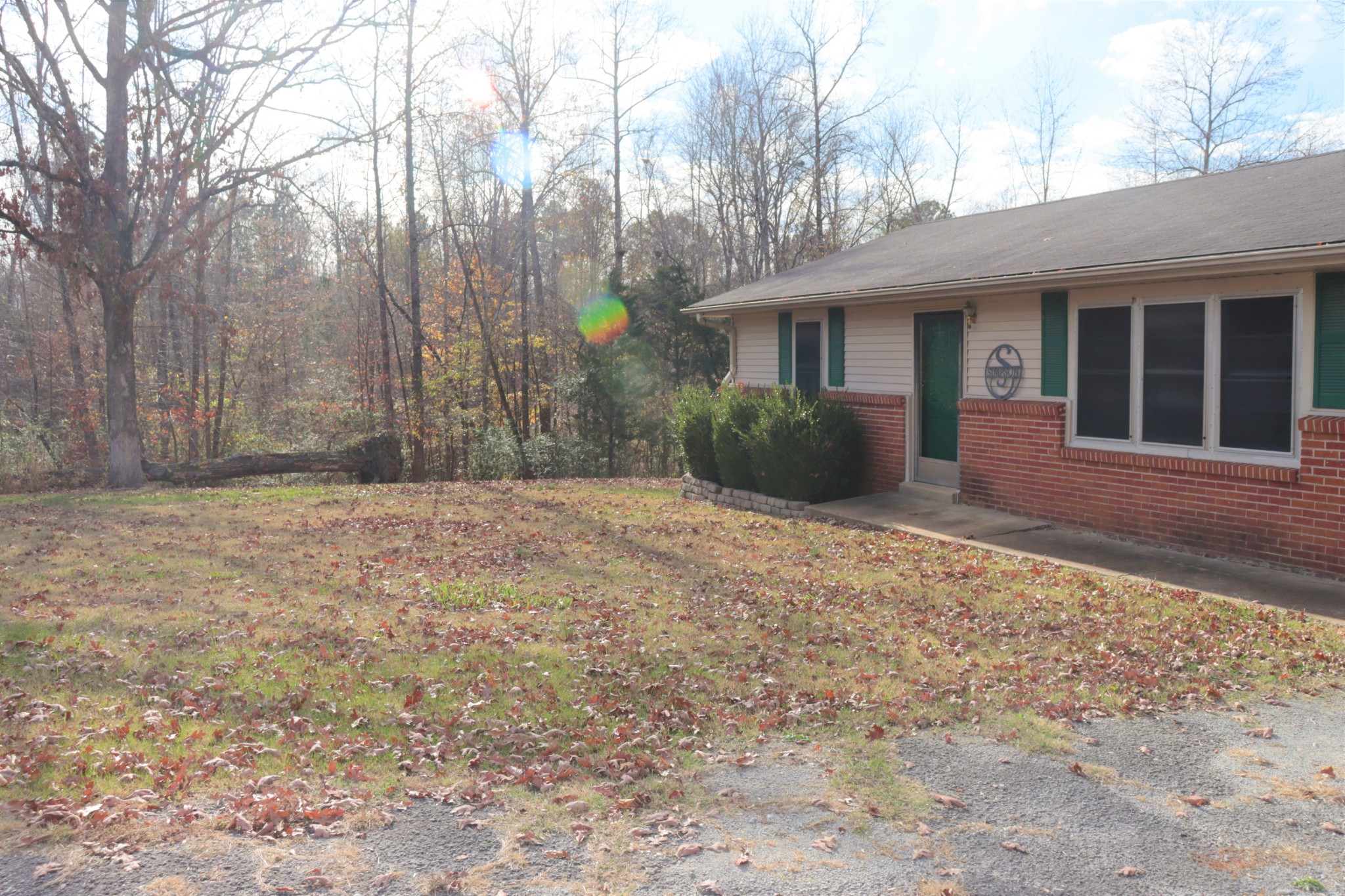176 Pine Street Parsons, TN 38363 - Photo 5 of 32 a front view of a house with a yard and potted plants
