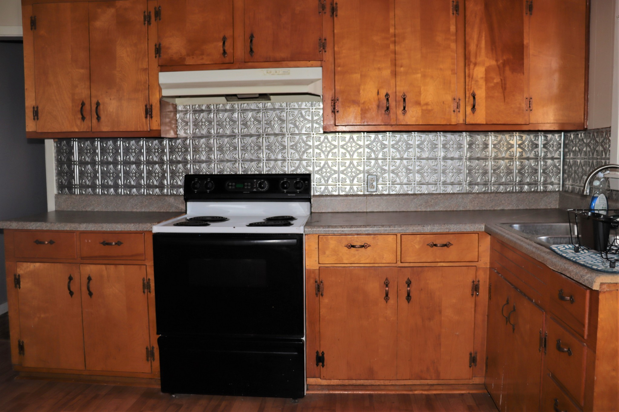 176 Pine Street Parsons, TN 38363 - Photo 9 of 32 a kitchen with granite countertop cabinets stainless steel appliances and a counter space