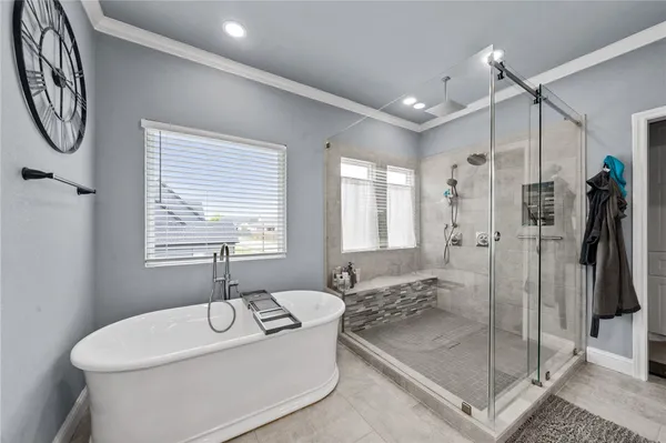 a bathroom with a granite countertop sink a toilet and shower