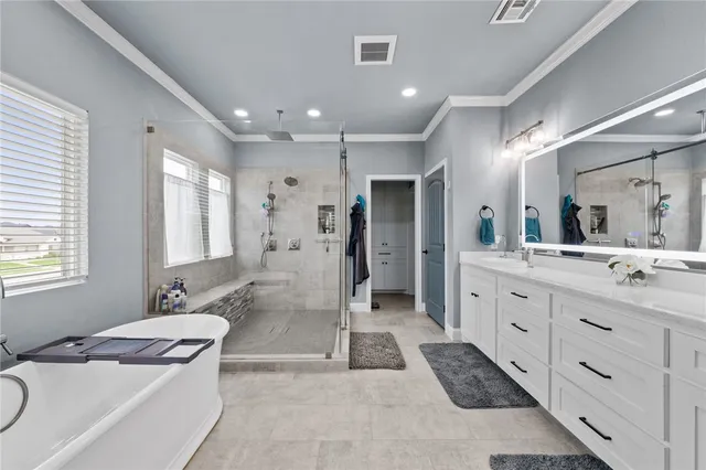 a spacious bathroom with a granite countertop sink mirror and shower