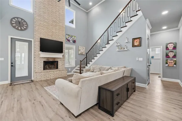a view of living room with furniture and a flat screen tv