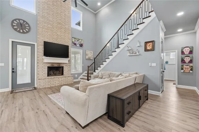 a view of living room with furniture and a flat screen tv