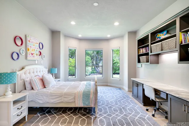 a bathroom with a sink a light fixture and a mirror