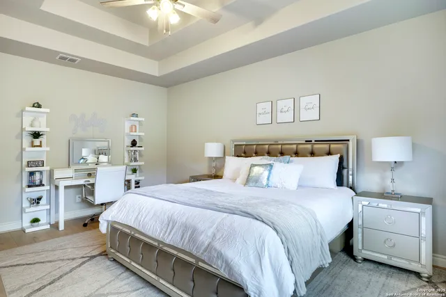 a bathroom with a granite countertop sink a light fixture and a mirror
