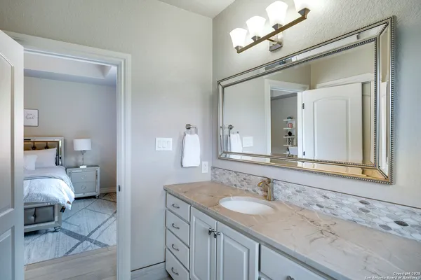 a kitchen with stainless steel appliances granite countertop a refrigerator sink and cabinets