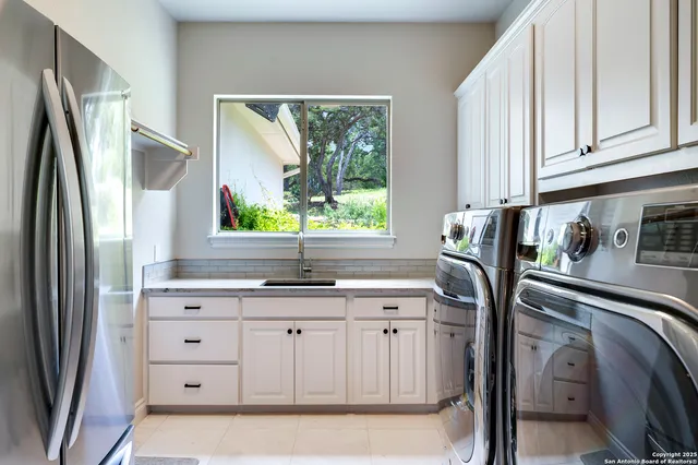 a kitchen with a stove and a large window