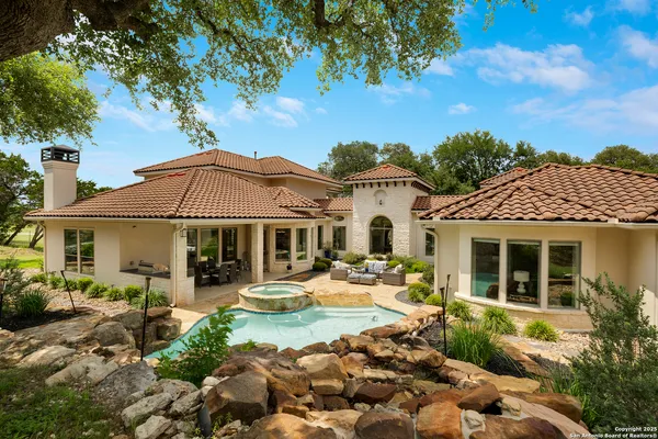 an aerial view of a house with outdoor space and street view