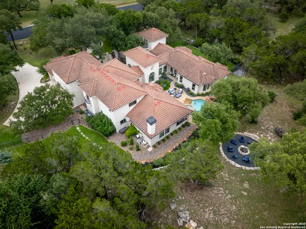 an aerial view of a house with outdoor space and street view