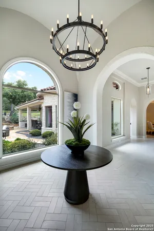 a view of a living room and chandelier
