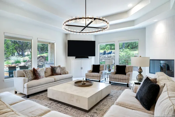 a living room with furniture and a table
