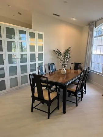a view of a bedroom with furniture and windows