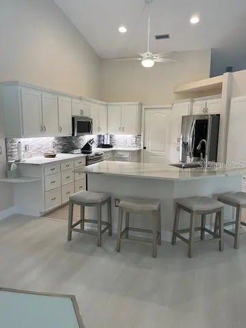 a view of a dining room with furniture and window