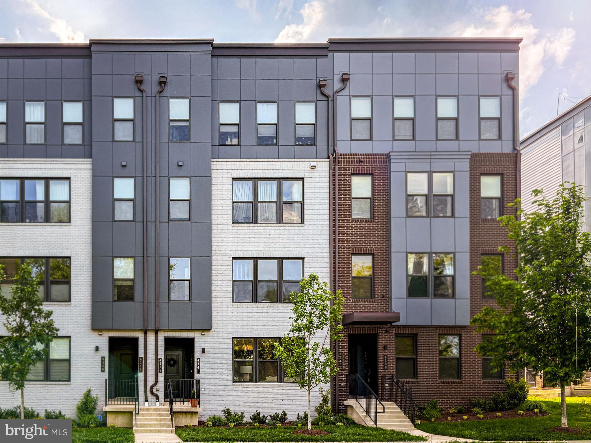4140 Legato Road, Unit 47 Fairfax, VA 22033 - Photo 1 of 23 a front view of a building with windows and glass windows