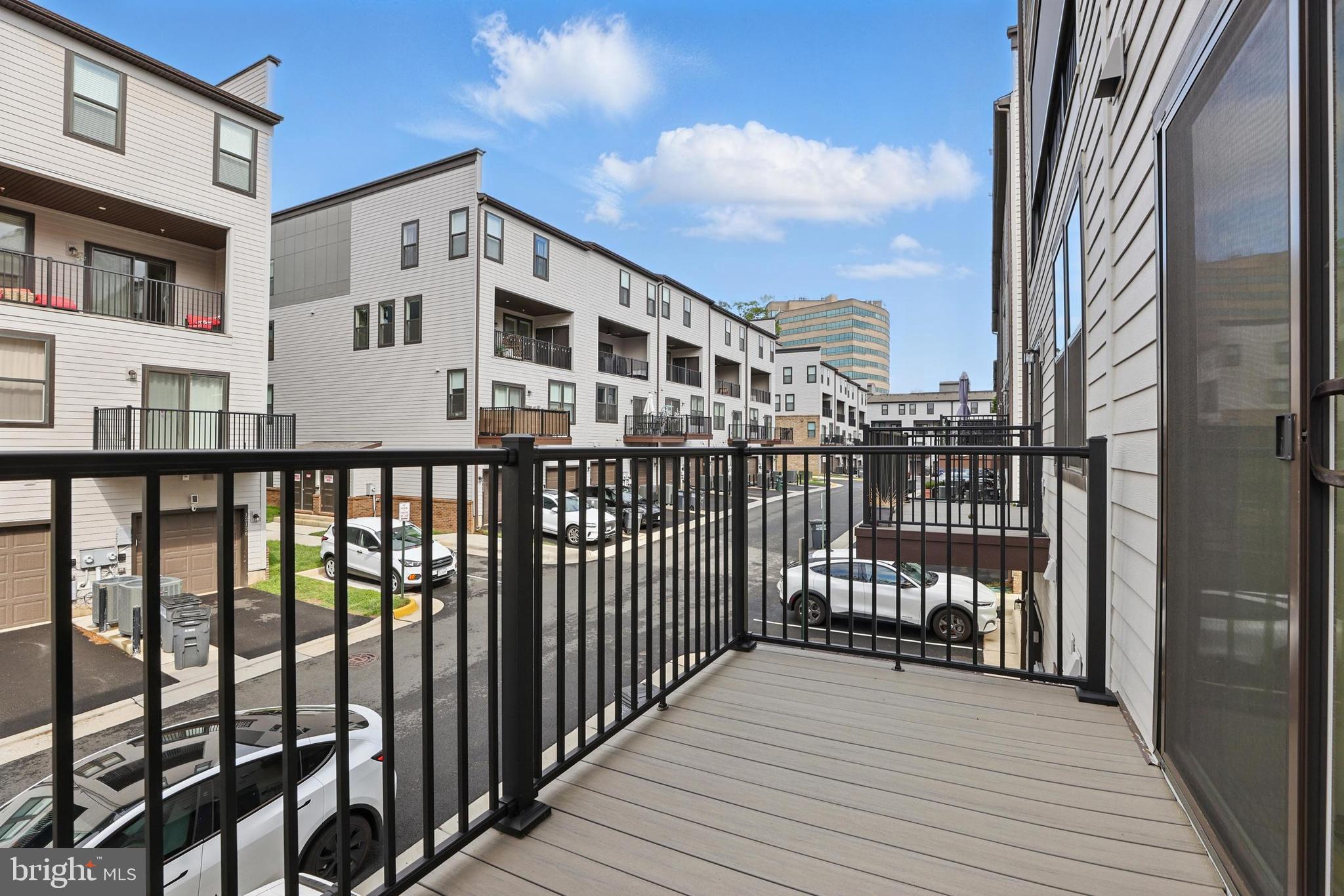 4140 Legato Road, Unit 47 Fairfax, VA 22033 - Photo 11 of 23 a view of a balcony with wooden floor